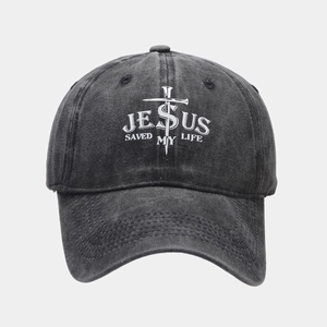 Detail of Jesus Saved My Life logo on washed dark grey cotton baseball cap with cross