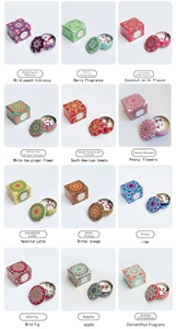 Set of 12 soy wax scented candles with dried flowers in mandala tin jars and gift boxes