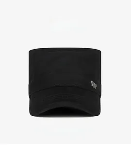 Side view of black cotton cadet hat featuring a metallic badge and minimalist design
