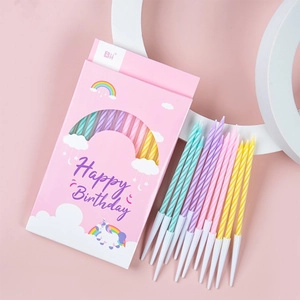 Colorful spiral birthday candles in rainbow unicorn box for party cake decoration