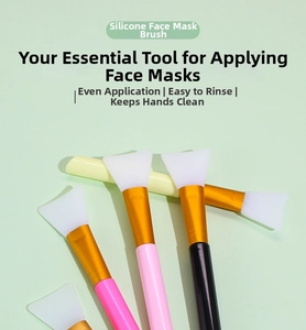 Detail of five silicone face mask brushes with colorful handles and gold ferrules