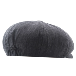 Detail view of washed cotton newsboy cap in dark grey with elastic back band