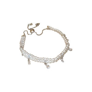 Elegant double-layered pearl bracelet with teardrop zircon charms and adjustable closure