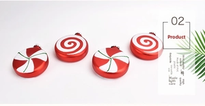 Detail of four PVC red and white candy swirls and stars Christmas disk ornaments