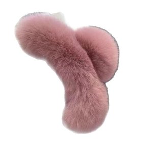 Pink faux fur hair claw clip for women featuring soft plush material on a white background