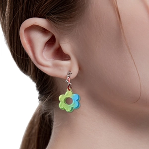Blue-green gradient floral resin earrings with silver hooks worn by a model