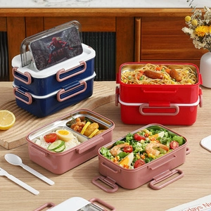 Detail of the stainless steel lunch box lid featuring a built-in hidden phone stand holder