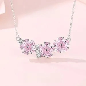 Close-up of S925 sterling silver necklace with pink cherry blossom crystals