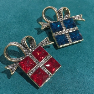 Festive gift box brooches with red and blue crystals and sparkling bow details