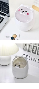 Mini desktop trash cans featuring cute bear and cat designs with clear flip lids