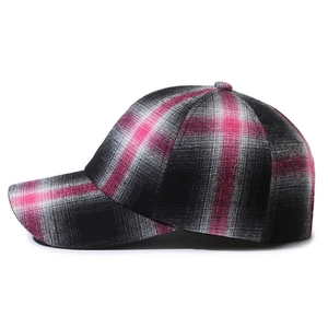 Pink black and white plaid pattern baseball cap with a classic curved brim for outdoors