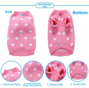 Detail of pink knitted pet sweater showing embroidered dots and elastic cuffs