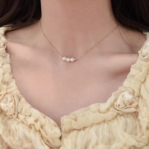 Minimalist 14K gold filled necklace with three natural freshwater pearls on a delicate chain