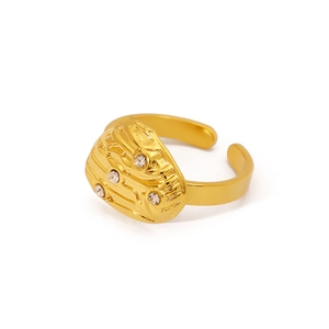 Golden starfish ring with star textures and crystal accents, adjustable open band style