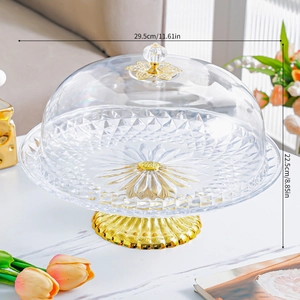 Detail view of European style cake plate with gold base and acrylic dome cover, 29.5cm size
