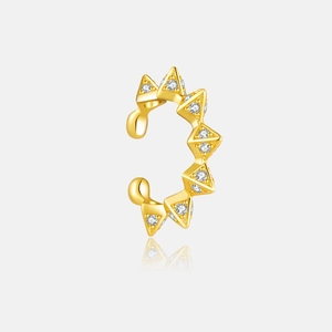 Macro view of a gold-plated 925 silver ear cuff with sparkling white zircon studs