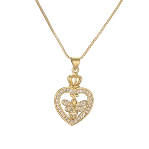 Macro detail of gold plated heart pendant with crown and zircon bee on box chain