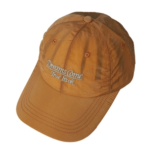 Quick-dry embroidered baseball cap in mustard yellow with Dreams Come True text detail