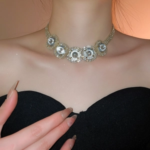 Close-up of luxury choker necklace featuring five crystal circles with pavé diamond halo