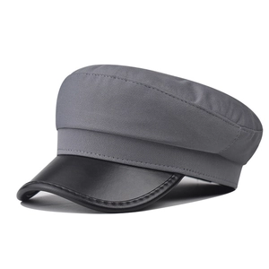 Chic dark grey wool newsboy cap with black PU leather brim and structured minimalist design