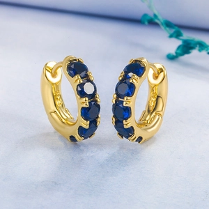 Gold S925 silver hoop earrings featuring four round deep blue zircons in a row