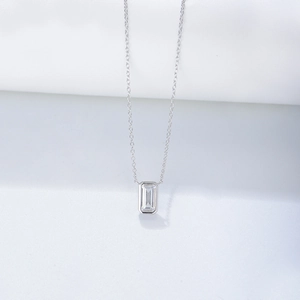 Minimalist S925 silver necklace with emerald cut square zircon pendant on white background