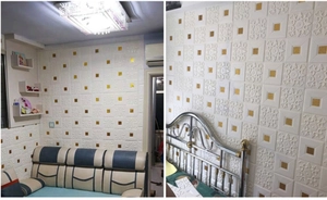 Detail of white 3D self-adhesive foam wall panels with embossed square pattern and gold accents