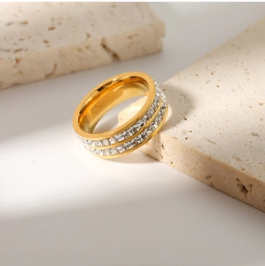 Macro shot of double-row white zircon inlay on an 18k gold-plated stainless steel ring