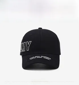 Close-up of black baseball cap with white MY embroidery and inspirational quote on brim