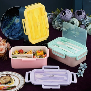 Detail showing colorful three-compartment bento boxes with cutlery and split food sections
