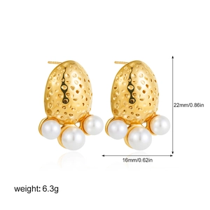 Detailed view of 18k gold plated textured metal earrings with white round pearls