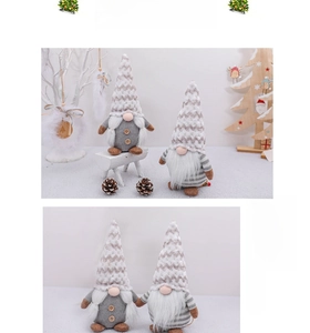 Detail of grey and beige knitted Christmas gnomes with wooden buttons and long white beards