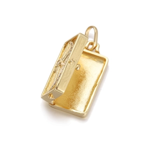 Macro shot of 18K gold-plated locket pendant with open rectangular hinge structure
