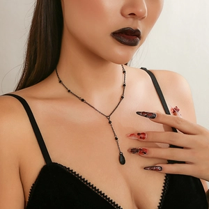 Close-up of a gothic Y-shape black beaded choker with a glossy teardrop pendant