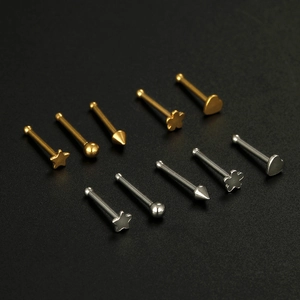 Macro detail of 12pcs stainless steel nose studs set in star heart and ball shapes