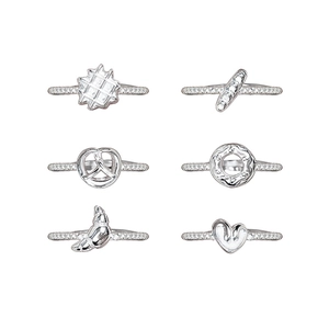 Set of 6 s925 silver rings featuring bread and heart shapes on white background