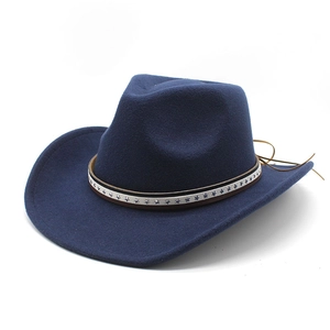 Detail of dark blue wool fedora with white star pattern band and brown leather cord