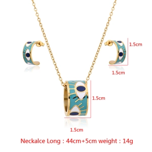 Detailed view of evil eye jewelry set with gold necklace and C-shaped earrings