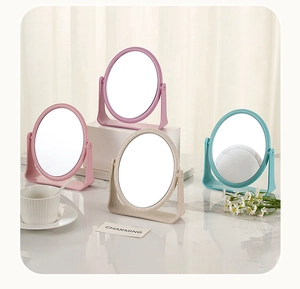 Group of four colorful oval tabletop makeup mirrors in wheat straw plastic frames