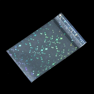 Macro detail of laser starry pattern and self-adhesive seal on clear packaging bag