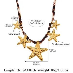 Detail of leopard print silk scarf necklace with five golden stainless steel starfishes
