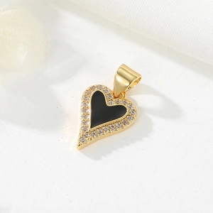 Detail of 14K gold plated heart pendant with black inlay and cubic zirconia stones