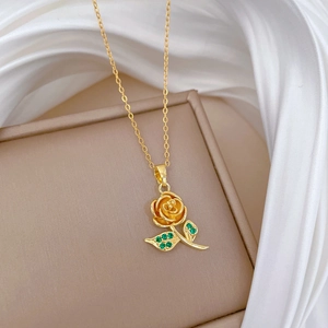 Luxurious gold rose necklace with green zircons and full diamond inlay on gift box