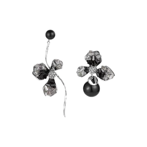 Asymmetric crystal flower earrings with black stones and metallic base on white background