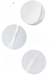 Detail of white nylon kitchen skimmer with drainage holes, non-slip stand and hanging hole