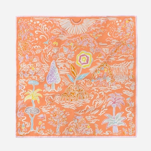 Detail showing tropical island floral print and Isola di Primavera text on orange silk scarf