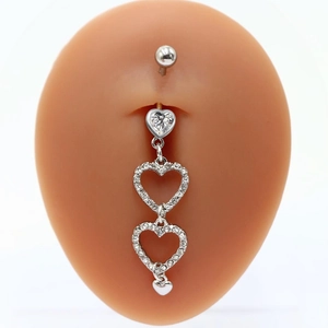 Detailed view of silver heart navel ring with crystal pave dangles on a belly model