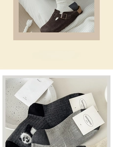 Detail of grey crew socks with cute panda patterns and soft flocked texture detail