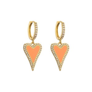 Detailed macro view of gold heart earrings with orange enamel and zircon pavé edges