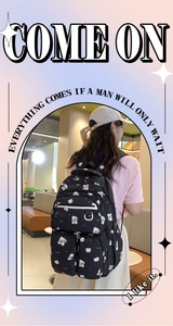 Detail of black backpack with cute white bear patterns worn by a model in interior